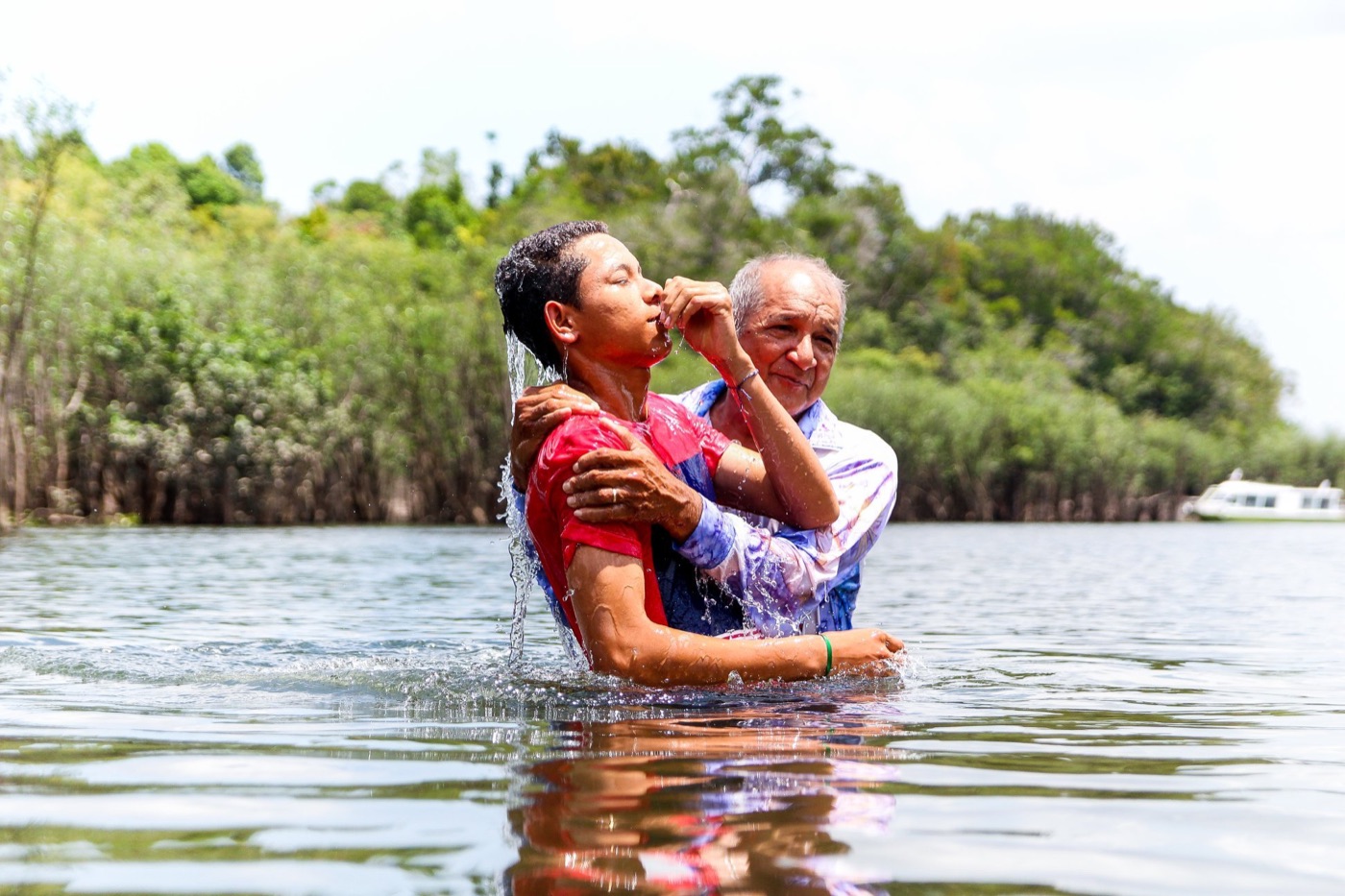 A baptism in a river in the Amazon